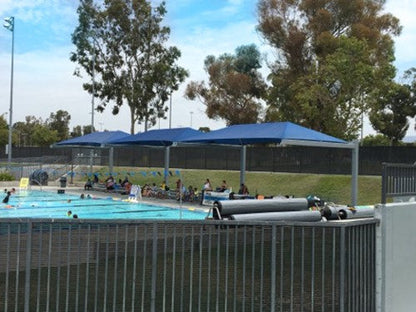Full Cantilever Hip Roof Shade Structure example; pictured size and colors may vary