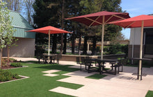 Modern Shade center-post umbrellas installation example; pictured size and colors may vary