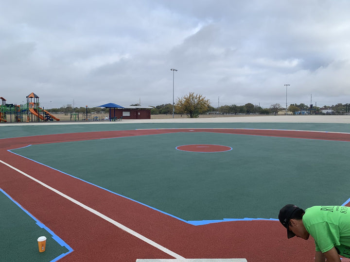Poured in place rubber   ball field