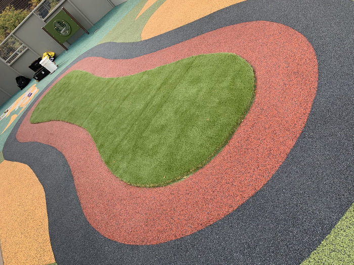 Turf island with rubber border